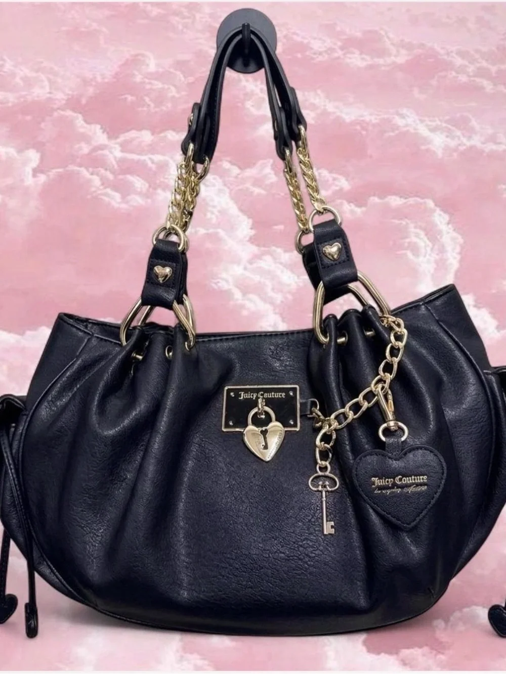 Juicy Couture Rolling On Satchel in the color licorice